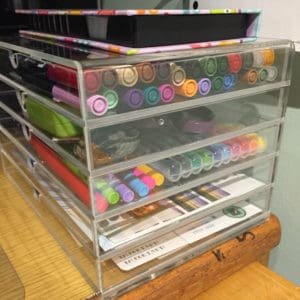 A set of acrylic drawers with Tombow Dual Brush Pens and Papermate Flair Bullet Journal supplies